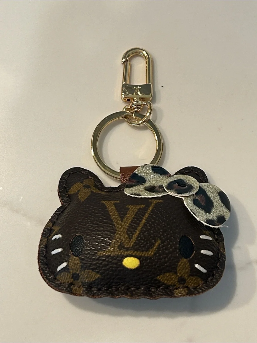Upcycled LV Gold-Tone Brown Monogram HK Keychain Bag Charm with Leopard Bow